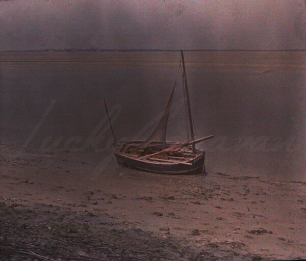 Fishing boat at Saint Valery in the Somme estuary. High resolution scan of a Lumière autochrome from the beginning of the 20th century.