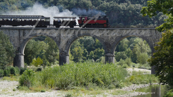 The Cévennes steam train on the la Plaine Thoiras-Lasalle bridge between Anduze and Saint Jean du Gard, southern France