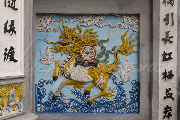 Relief representing a dragon at the entrance of the Ngoc Son Buddhist temple or Jade Mountain Temple in Hanoi, Vietnam, Southeast Asia