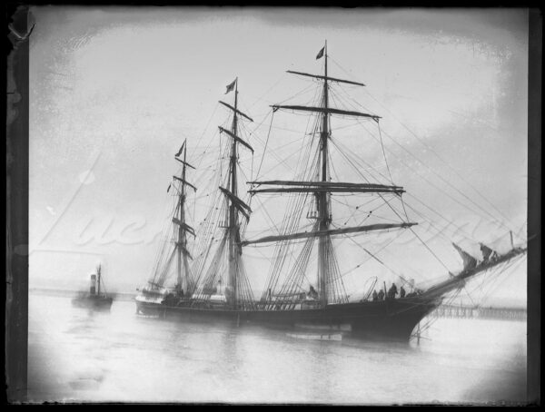 3 masted old rigging sailboat and tugboat in Dunkirk harbour, France, at the end of the 19th century