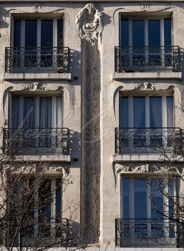 Sculpted art nouveau facade with mother and child, Paris, France