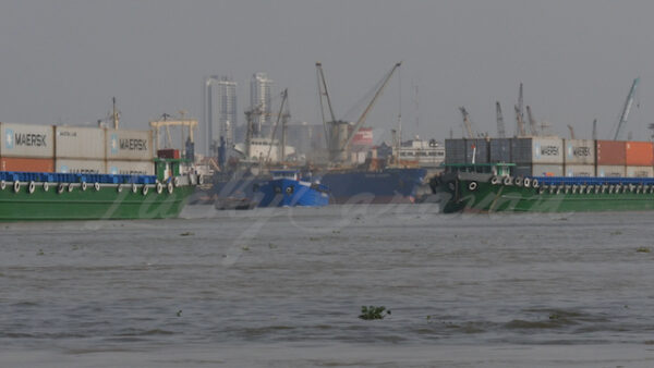 Container barges in Ho Chi Minh City (Saigon) harbor, Vietnam