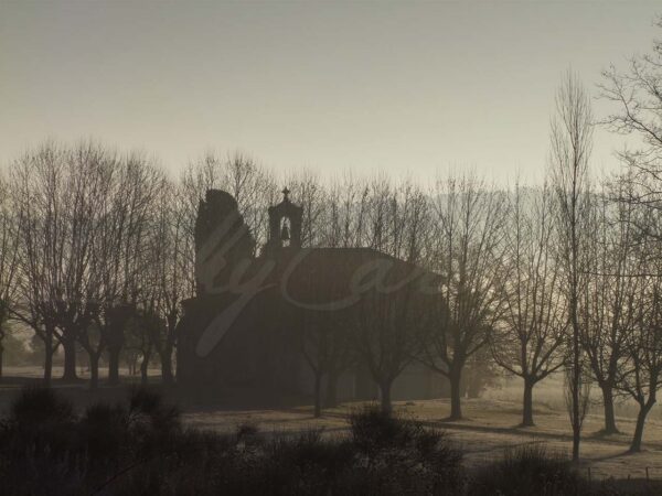 12th century rural chapel in the morning mist