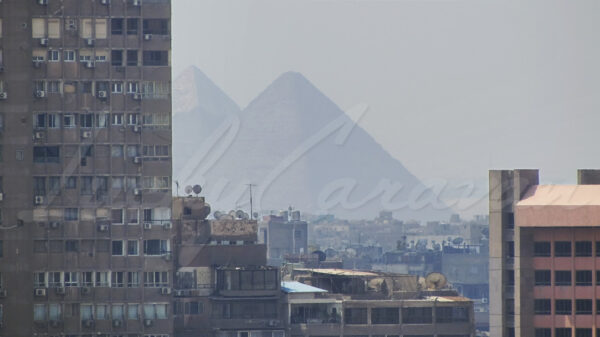 A glimpse of the pyramids of Giza from downtown Cairo through a thick layer of pollution
