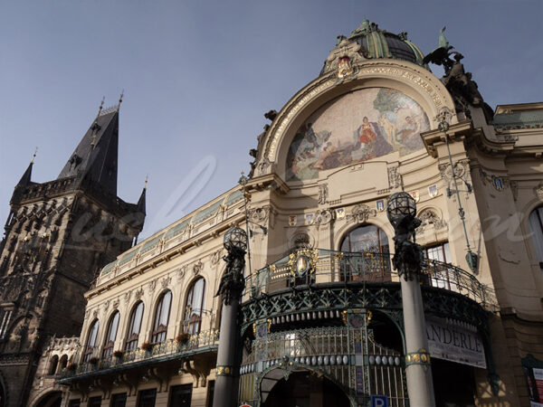 The art nouveau-style municipal house next to the gothic-style powder tower in Prague, Czech Republic.