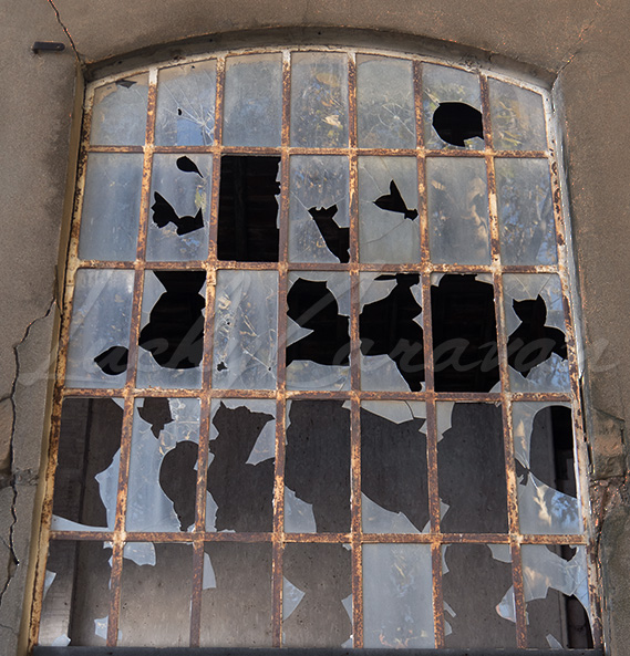 Factory window with broken glass.
