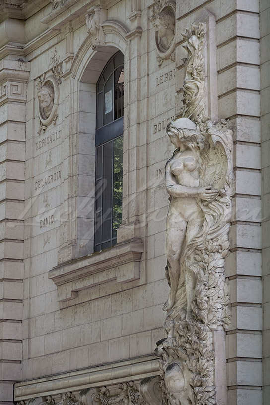 Detail of the monumental façade of the Ecole Supérieure des Beaux-Arts in Toulouse with the allegory dedicated to the art of engraving, France