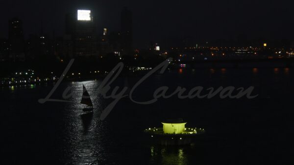 Feluccas by night on the Nile in Cairo, Egypt