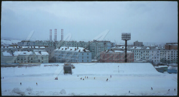 General view of Murmansk with the stadium in the foreground and port facilities in the distance, Barents Sea, Arctic Circle, Russia, 1997