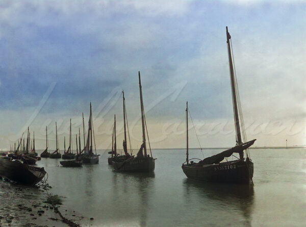 Traditional fishing boats in Somme Bay, France, circa 1900.