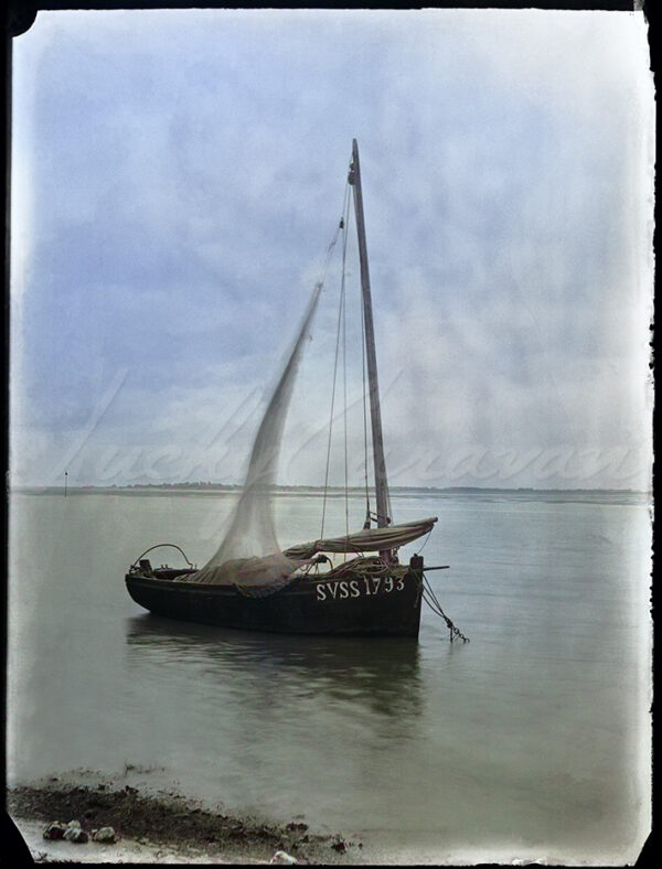 Traditional fishing boat in Somme Bay, France, circa 1900