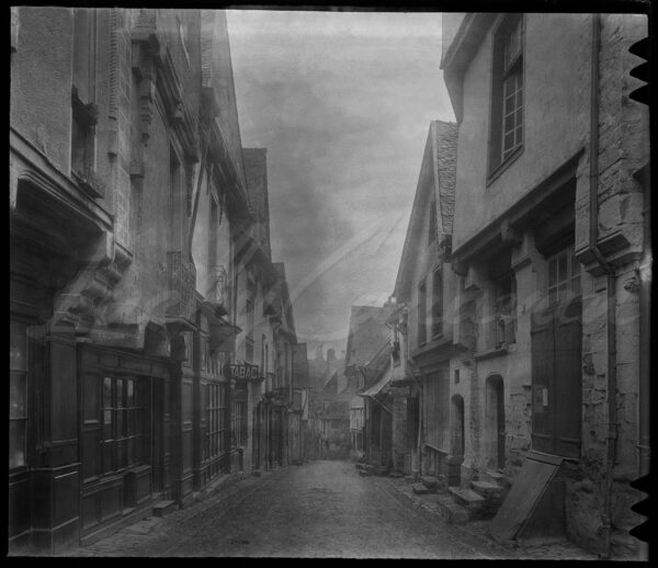 15th-century houses in Vitré, a traditional French village, circa 1900.