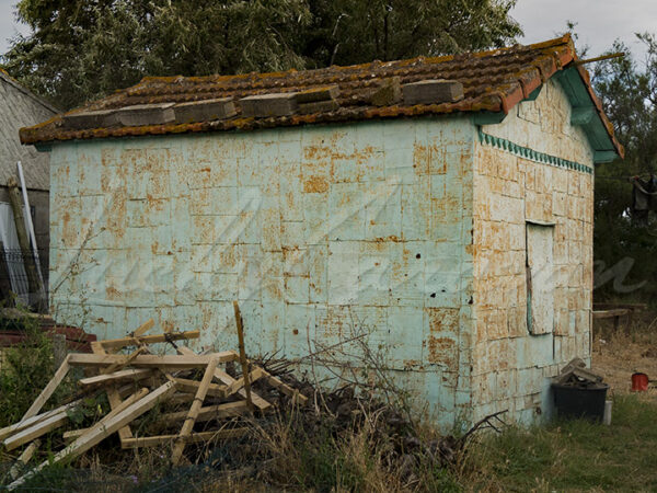 Shack covered with nailed metal plates