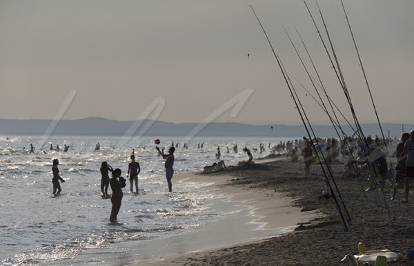 Vacationers on a beach in August, Occitania, southern France
