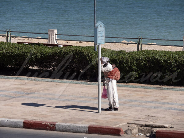 African migrant and her child on the southern coast of Morocco.