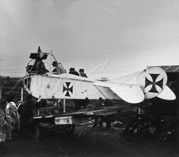 Soldiers around a dismantled Albatros, a German reconnaissance biplane during WWI