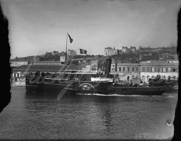 The paddle steamer “Chicago” sailing past port facilities, France, early 20th century