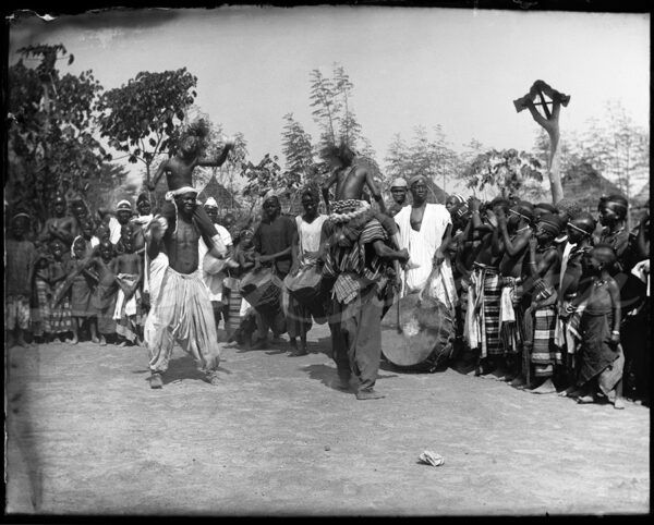 Traditional dance in a village in Guinea, circa 1900.