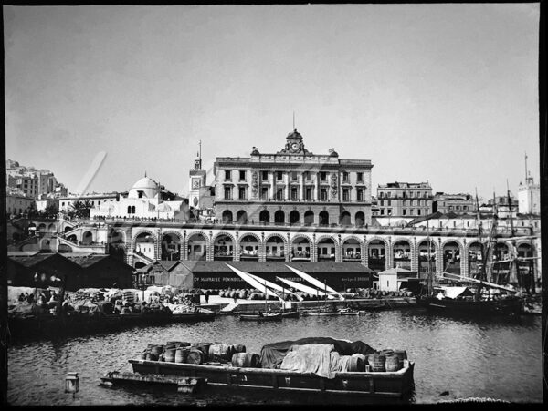 Overlooking the harbour, the Consular Palace, built in 1889 by the architect Henri Petit in the Neoclassical style, houses the Algerian Chamber of Commerce and Industry in Algiers, Algeria, here in the early 20th century.