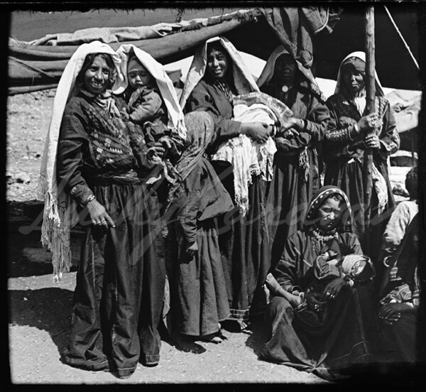 Palestine. Bedouin women and children in front of their tent. Early 20th century.