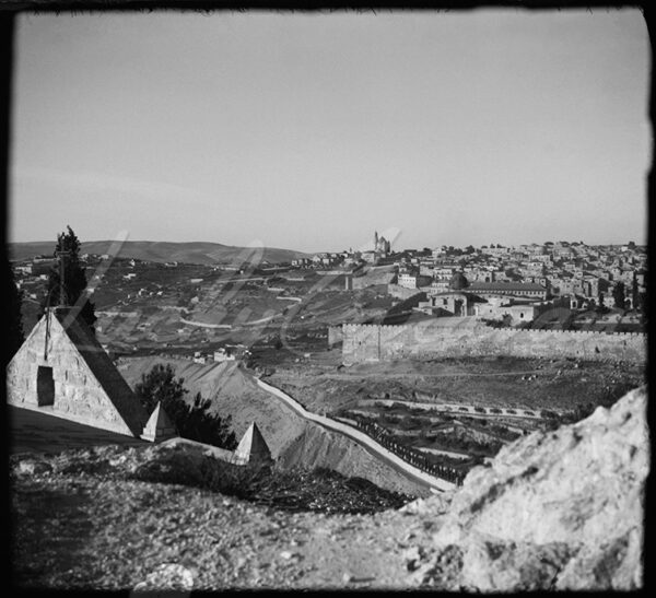 A panoramic view from the Mount of Olives of the walls of Jerusalem, featuring the Al-Aqsa Mosque, Mount Zion and the imposing Abbey of the Dormition. Early 20th century.