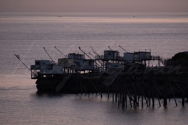 Fishermen’s huts on the Charente coast at sunset, France