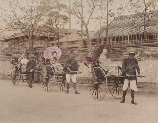 Young women in rickshaws in front of an inn, Japan, c. 1880.