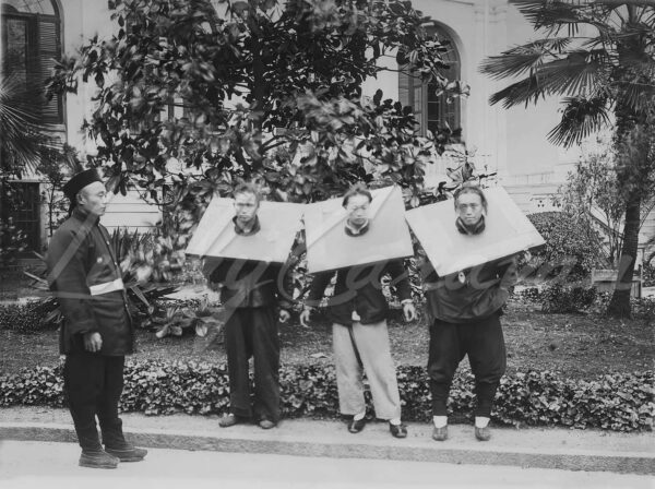 Three prisoners in their cangues in Shanghai, China, circa 1900.